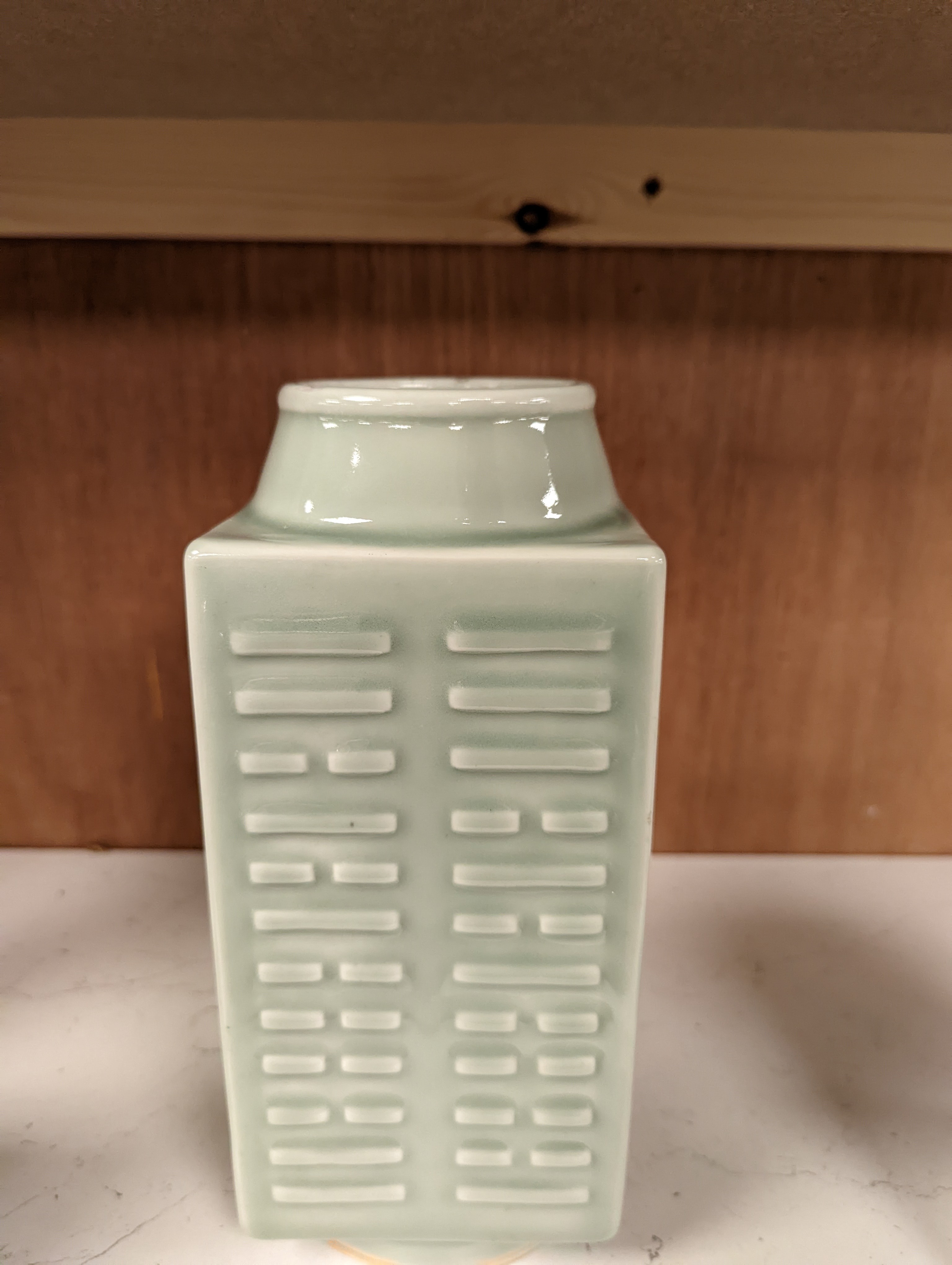 A Chinese celadon glazed eight trigrams cong shaped vase, Guangxu mark and possibly of the period. Provenance - owner bought in auction 20 years ago. 25cm tall